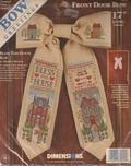 Cross stitch kit - Bless This House Bow - With houses on it.  It is 17" long.  It is by Hunter Brown through Dimensions.