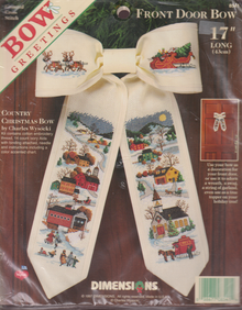 Country Christmas Bow  for a door decoration.  17" long  It is a Cross Stitch Kit of a Village with snow.  by Charles Wysocki.